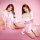 Two women wearing mannyqing sensual ice silk sleep dresses, featuring lace trimmings and sheer fabrics, posing elegantly agai...