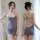 Woman modeling mannyqing gray backless bodysuit with crisscross straps and sheer mesh tights set.