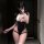 Woman wearing mannyqing sexy cut-out bodysuit with high-slit mesh design, posing in mirror for boudoir or fitness styling.