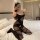 Woman in black sheer lingerie set with open-crotch bodysuit, posing on bed. mannyqing sexy lingerie set - sheer secretary sle...