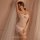 Woman wearing white sheer mesh bodycon lingerie with cut-out back, posing elegantly beside soft drapes — mannyqing seductive ...