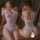 Sheer lace open-crotch bodysuit with floral details, shown front and back on model in romantic bedroom setting.