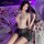 Manyan ol secret cosplay uniform: sheer plaid bodysuit with backless design and bodycon skirt, styled on a bed with rose peta...