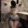 Woman in manyan ol secret cosplay uniform: sheer plaid bodysuit with backless design and bodycon skirt, posing in marble bath...