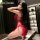 Sexy red lace low-cut slip dress with side slit, perfect for women seeking elegant yet daring fashion.
