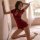 Sexy red lace qipao lingerie featuring cut-out bustier design, sheer details, and ties, perfect for women seeking elegant yet...