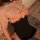 Elegant black bodysuit with sheer lace accents and a large bow detail, perfect for small bust women seeking pure allure and s...