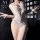 Woman wearing manyu romantic lace open-crotch bodysuit – sensual sheer lingerie with pink bows and cutout details.