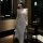 A woman models the manyu sexy lingerie set, featuring a sheer mesh backless sleepwear dress with a high slit and adjustable s...