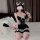 A woman poses playfully wearing a black meidihui lolita maid dress with lace details and white accessories, holding a whip ac...