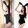 Woman wearing black bunny girl bodysuit with deep v neckline, ears, and bow tie. sexy costume set for adults in elegant pose ...