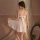 A woman models the minaer sexy mesh sleepwear set, featuring a sheer lace nightgown with backless straps and a bow detail, pa...