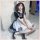 A girl wearing a black and white maid costume dress, featuring ruffles and bows, perfect for lolita cosplay or crossplay enth...