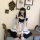 A stylish lolita maid dress featuring black and white colors with ruffles, perfect for cosplay or fashion.