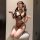Woman modeling mist temptation lingerie set, a pure and alluring catwoman-style sexy sleepwear with leopard print and black f...
