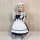 A woman poses wearing a miyano plus size japanese-style cosplay maid dress, featuring black and white colors with ruffles and...