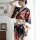 A woman models a moxin japanese-style kimono-themed lingerie set, featuring vibrant floral patterns on black fabric, perfect ...