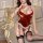 A woman models a festive red velvet bunny costume with a bow design, perfect for holiday-themed sleepwear. the outfit feature...