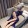 Woman in naben sensual lingerie – modest yet alluring lace cami set, seductive sleepwear & uniform-inspired nightwear.