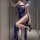 Woman wearing blue lace suspender lingerie with high slit, posing elegantly in hallway — night breeze seductive lingerie set.