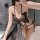Woman wearing black butterfly-themed lingerie set with adjustable ties and open-crotch design, elegant sleepwear for plus siz...