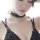 Elegant black lace choker neckpiece paired with delicate lace sleepwear, perfect for romantic and sexy nightwear.