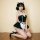 A woman poses in a black and white maid costume featuring an underwire push-up bra, lace details, and heels, perfect for sedu...