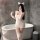 Woman in white backless lingerie set with cat ears and gloves, posing by bathtub. night-ser night-sex lingerie set for passio...