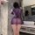 Woman wearing purple night si sheer mesh lingerie with pearl details, posing in bathroom.