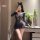 Woman modeling night silk seductive maid costume set, featuring mesh lingerie with cutouts and bunny ears.