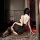 Woman wearing black and white night-silk seductive secretary outfit, alluring lingerie set with no-remove design.