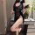A woman poses elegantly wearing a black lace night silk dress inspired by chinese cheongsam design, featuring frog buttons an...