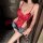 Woman wearing red lace bodysuit and denim shorts, holding wine glass. night-silk sensual lace open-crotch sleepwear set – she...