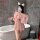 A woman poses in a bathroom wearing a pink sheer mesh sleep dress with an open-crotch design, holding a glass of champagne wh...