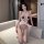 Woman wearing white and red night-three sensual lace bodysuit, open-crotch design, sheer fabric, teasing style for couples.