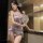 A woman elegantly poses holding a decorative fan, wearing a delicate nightwear set inspired by traditional chinese design. th...