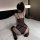 Woman wearing sheer mesh lace lingerie set on bed, showcasing the nightclub queen sexy lingerie for women.