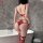 Woman wearing red nightsigh lace bodysuit with open-crotch, cut-outs, and mesh details in a modern bathroom setting.