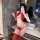 Woman in red lace lingerie set with sheer bra, thong, and stockings posing in bathroom mirror selfie.