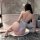 Woman in white nightsigh nightseduce lace bodysuit, kneeling on bathroom floor with cat ears, showcasing seductive sleepwear ...