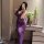 Woman in purple nightsigh nightseduce lingerie set, sheer sleepwear with floral detail, posing by vanity with flowers and win...