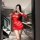 Woman in red sheer lace bodysuit with open-crotch design, posing in modern kitchen. nightsigh nightseduction hosiery for wome...