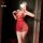 Woman modeling red lace nightsigh sleep dress with tassels, deep v neckline and tie-up straps for sexy nightwear.