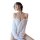 Woman wearing white sheer off-shoulder nightsigh lingerie set, snowflake-style chemise nightgown with delicate straps.