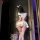 Woman in nightsiren sweet-spicy sailor uniform set with mini skirt, crop top, thigh-highs, and bunny ears — seductive college...