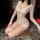 Woman wearing nightsiyese lace v-neck sleepwear set, elegant sheer lingerie for nightclub and date nights.