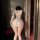 Woman wearing nightsiyese lace v-neck sheer sleepwear, back view showing elegant lingerie outfit for date nights.