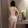 Woman wearing white lace sleep dress with sheer mesh camisole top, elegant nightgown for intimate moments.