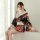 A woman models a japanese geisha-inspired sleepwear set featuring a floral kimono robe with a plunging neckline, perfect for ...