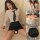Woman modeling ol secretary lingerie set with white blouse, black tie, and pencil skirt for seductive cosplay sleepwear.